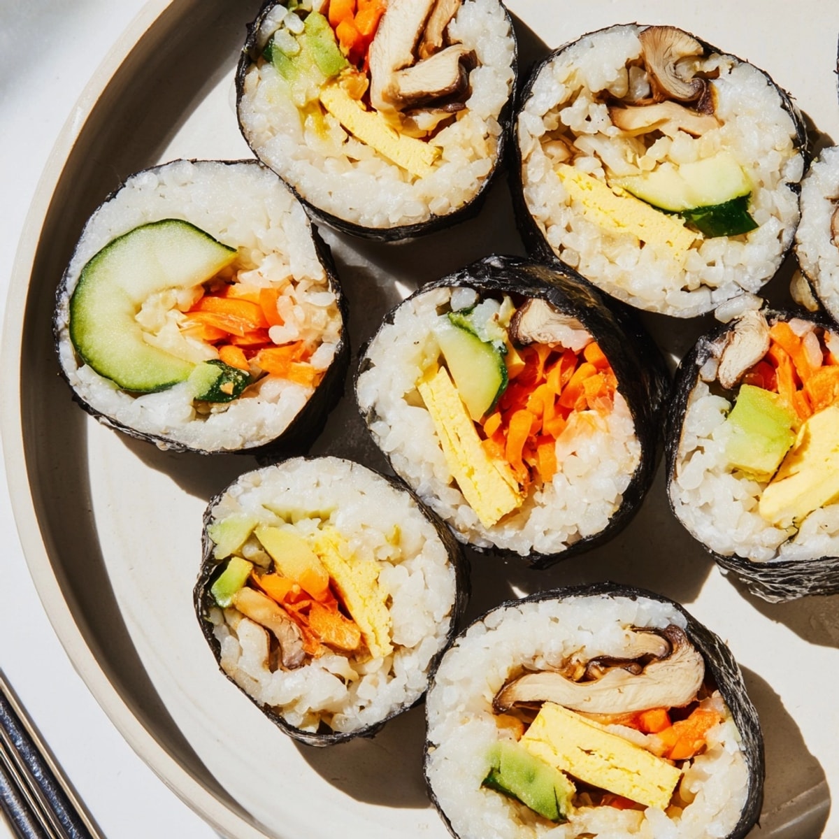 Vibrant Futomaki Sushi Rolls: A rainbow of fresh veggies and egg in seasoned rice.