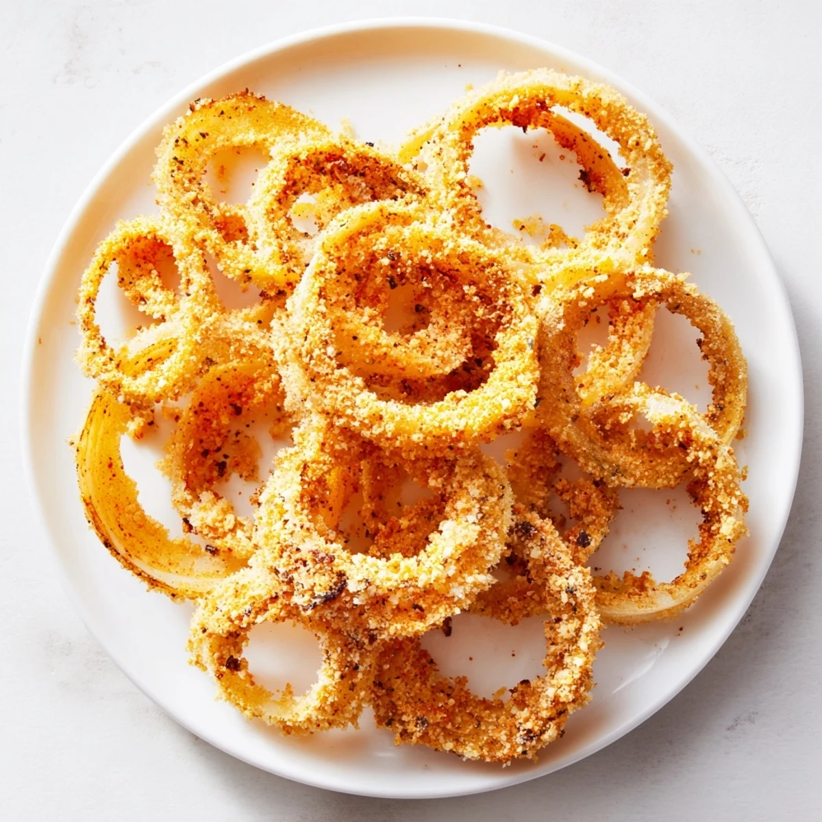 Delicious, homemade crispy baked onion rings, a vegetarian appetizer with amazing crispy texture.