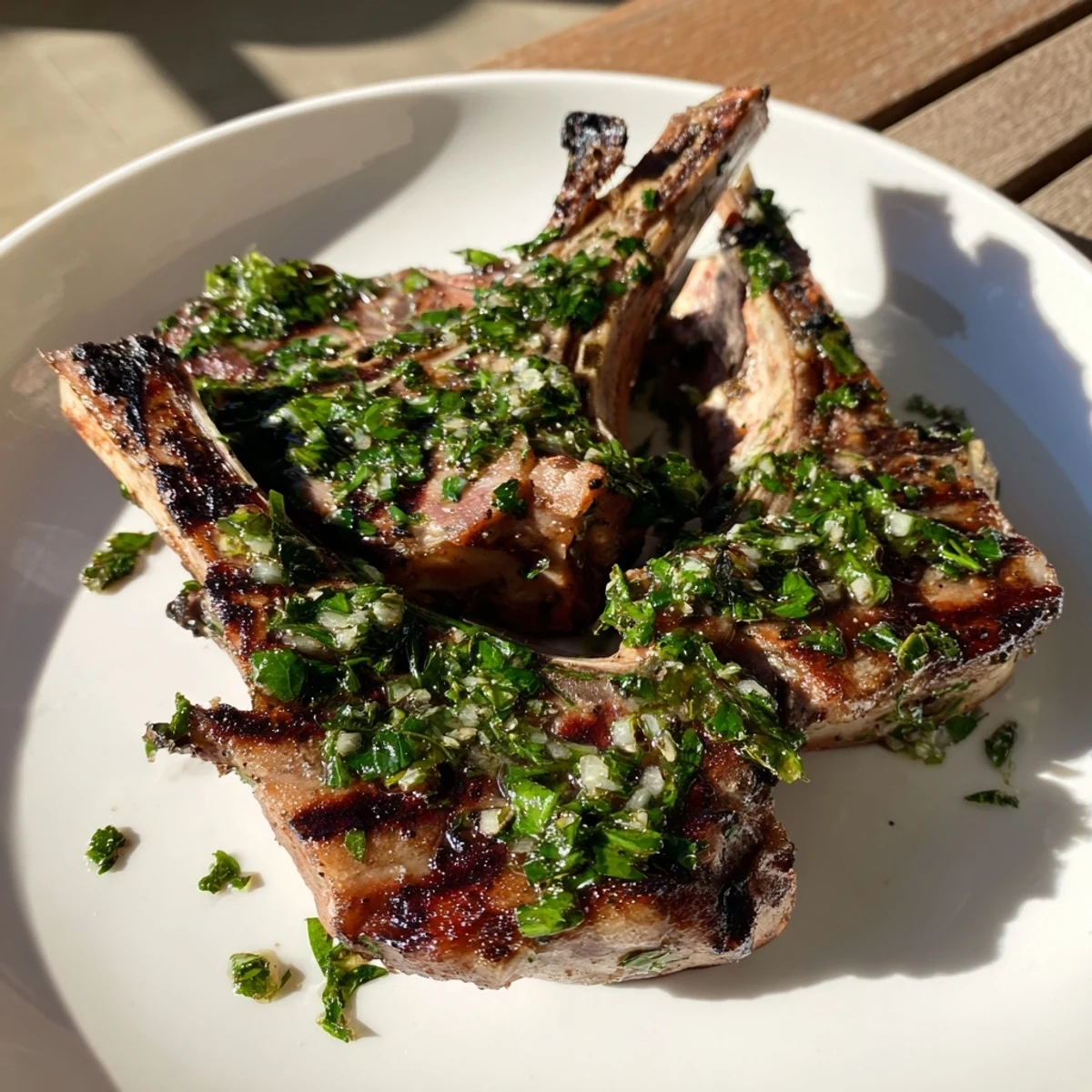 Sizzling grilled lamb chops, a Mediterranean delight, complemented by zesty, homemade mint sauce.