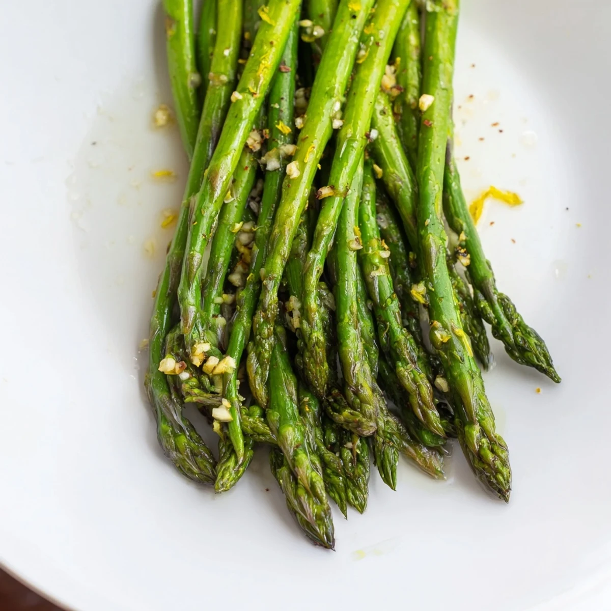 Sizzling Garlic Asparagus: bright green asparagus with glistening garlic, ready to eat.