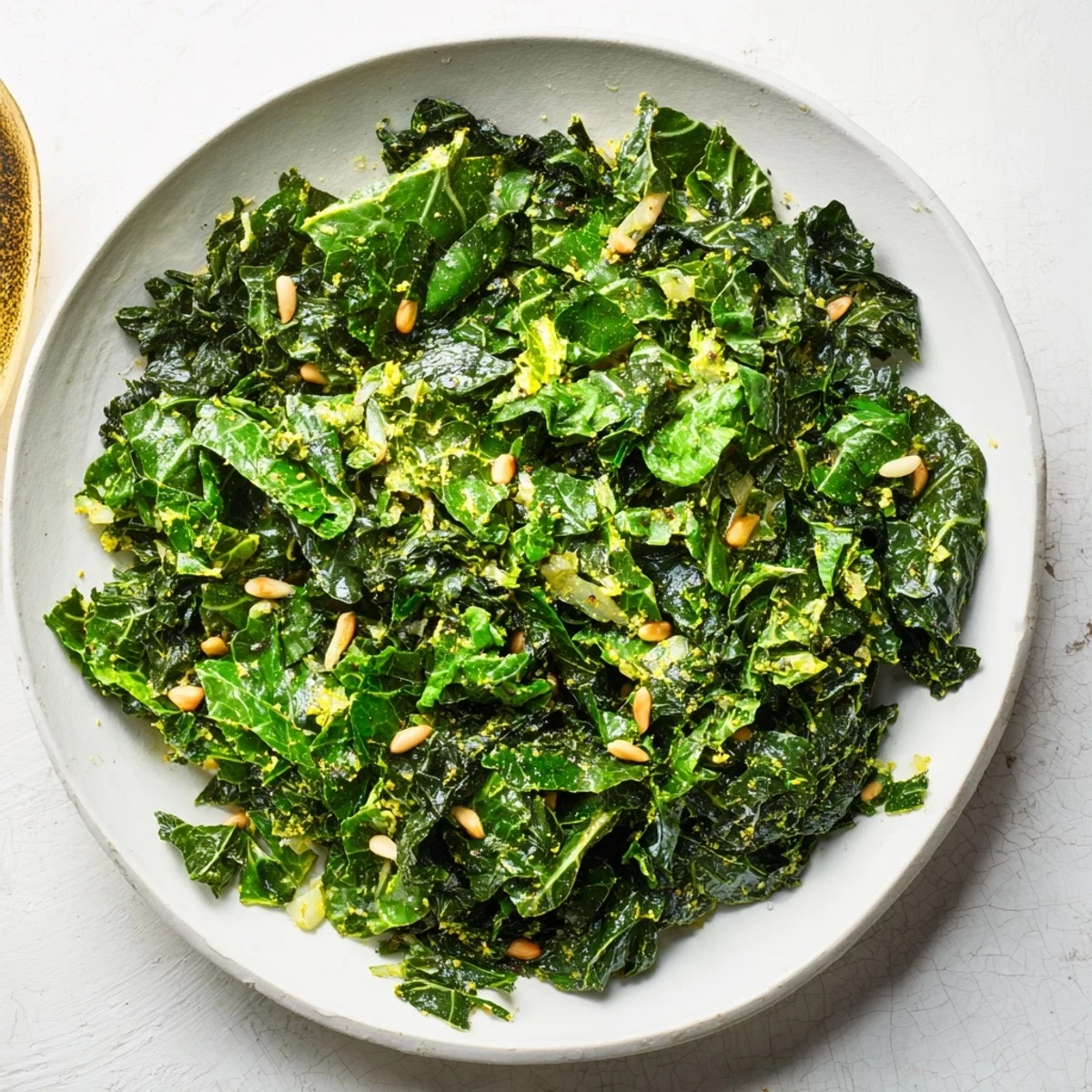Freshly cooked winter greens with garlic and lemon; bright green and flavorful, perfect side.