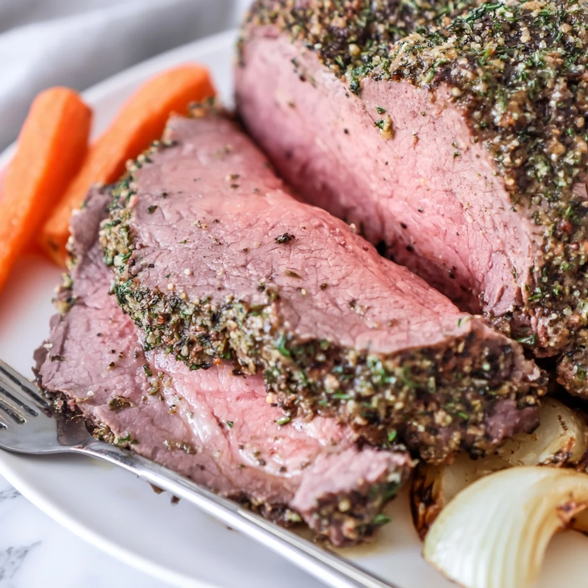 Freshly roasted Herb Crusted Roast Beef Topside rests, revealing a savory herb crust and tender pink center.