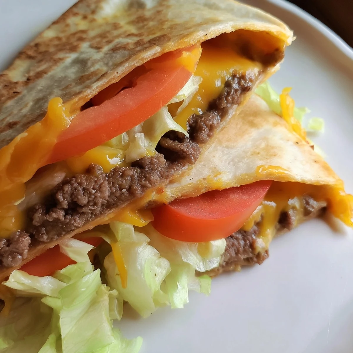 Golden crispy smashburger quesadilla filled with juicy beef patties and melted cheddar cheese