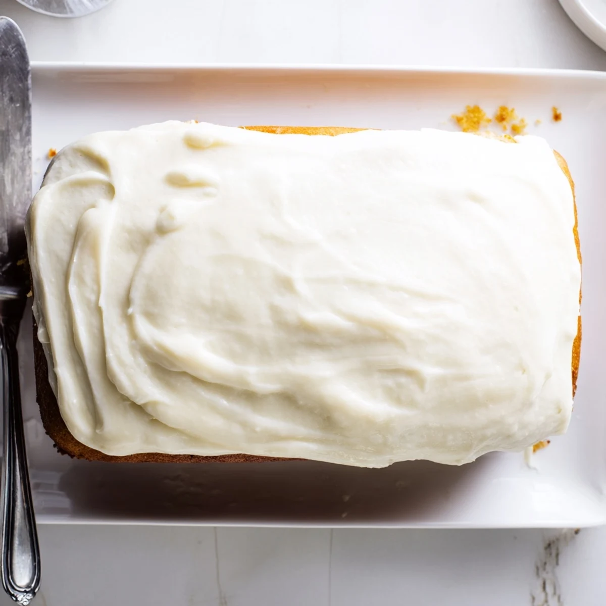 Light and fluffy church cake with swirl frosting perfect for potluck gatherings