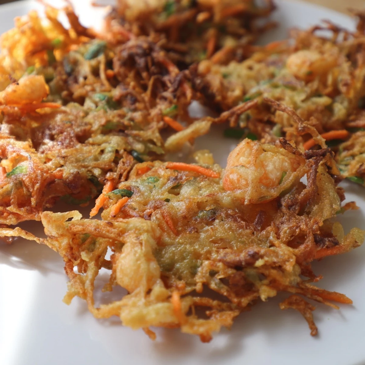 Ukoy Filipino shrimp fritters loaded with julienned vegetables and small whole shrimp fried until crunchy