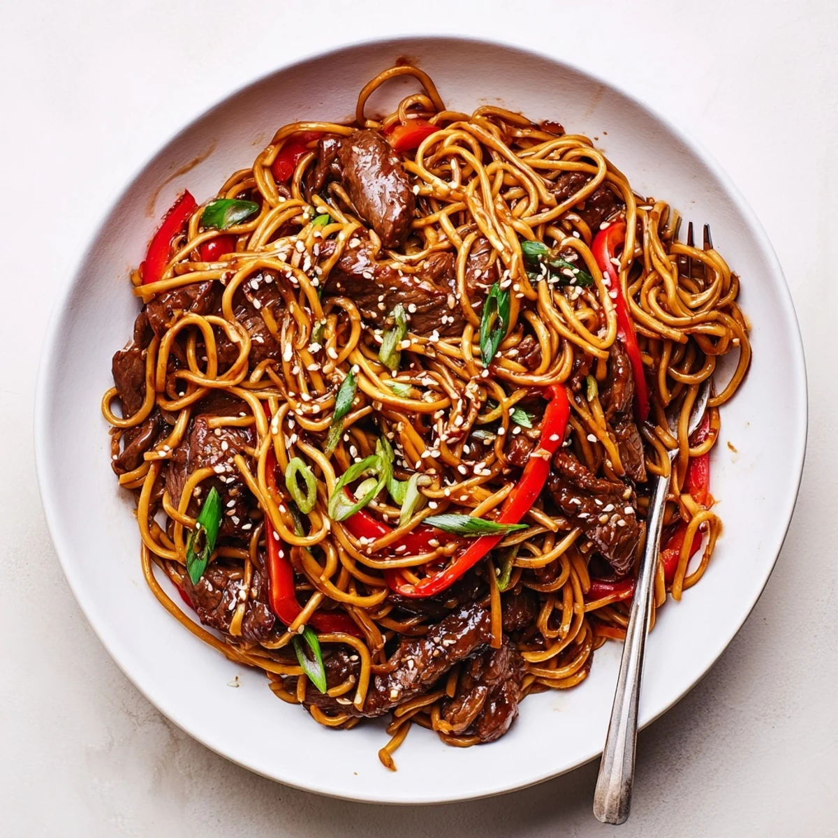 Weeknight Sticky Beef Noodles served immediately with jasmine tea, sweet-savory aroma
