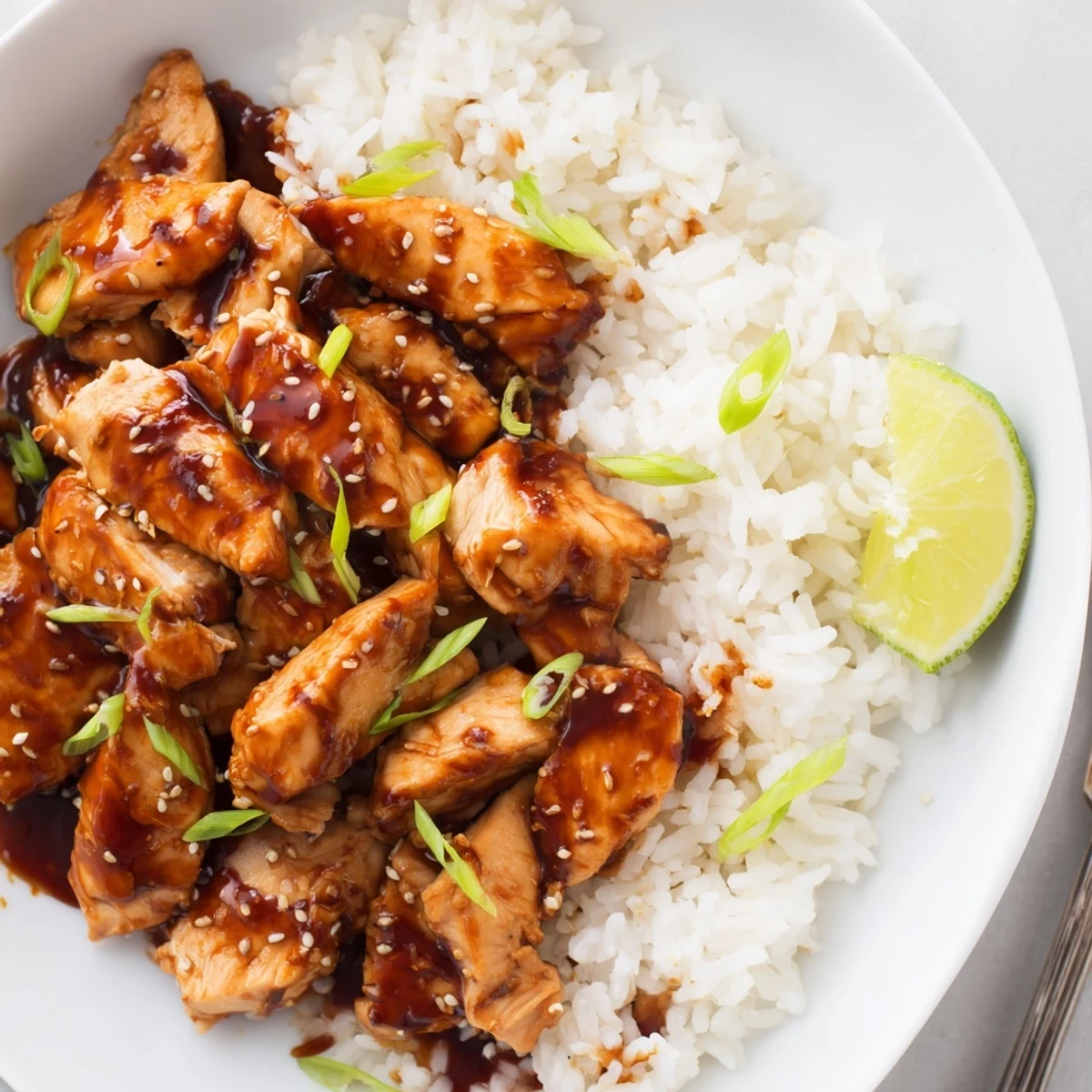 Weeknight Spicy Maple Chicken And Coconut Rice fork-ready, sweet-spicy glaze, lime on side