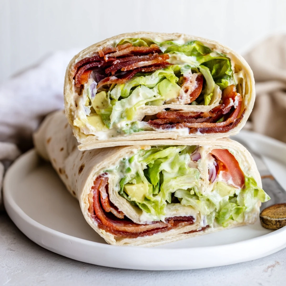 Crunchy Meal Prep BLT Wraps rolled tight, ready for weekday lunches.