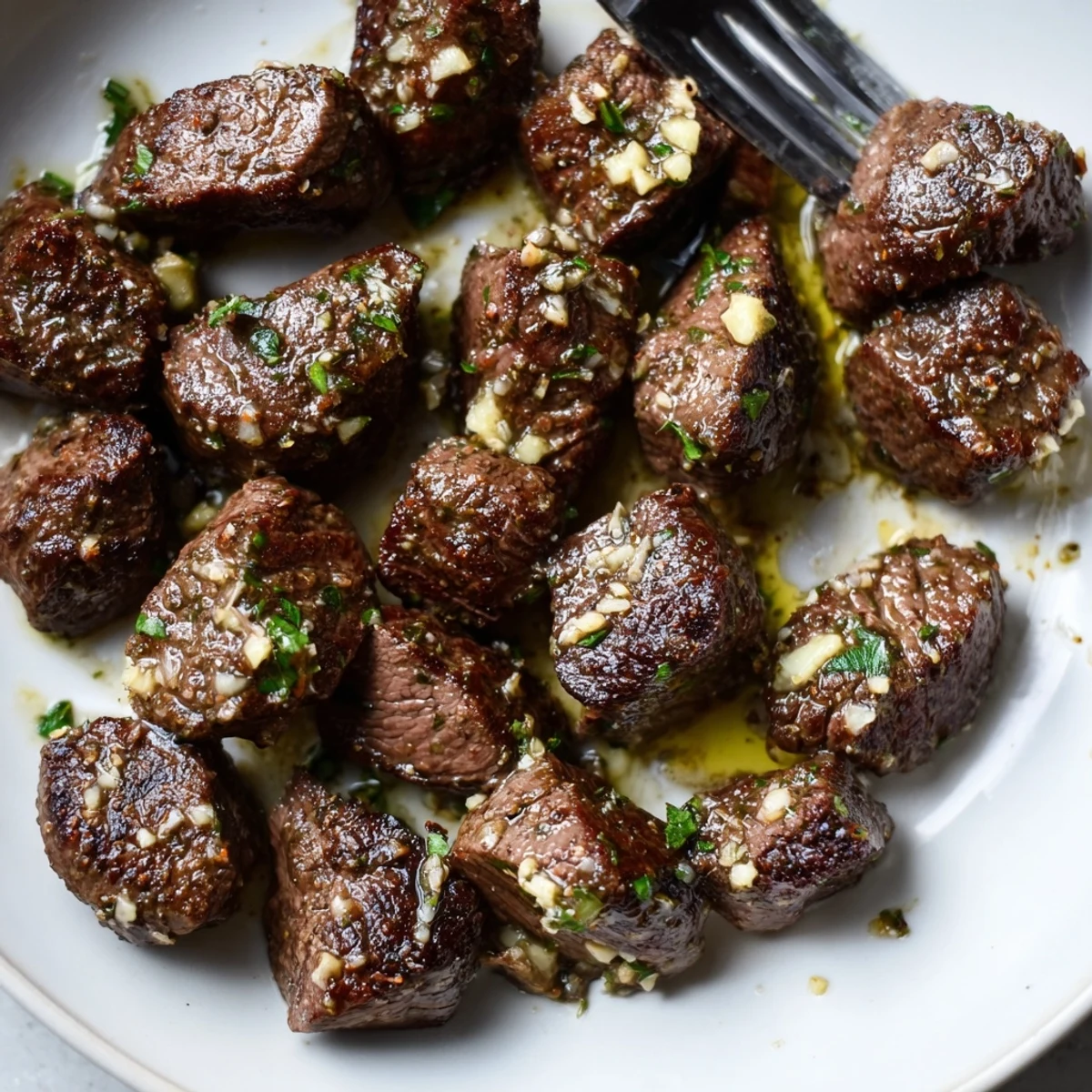 Juicy Garlic Butter Steak Bites tossed with parsley, perfect for crusty bread