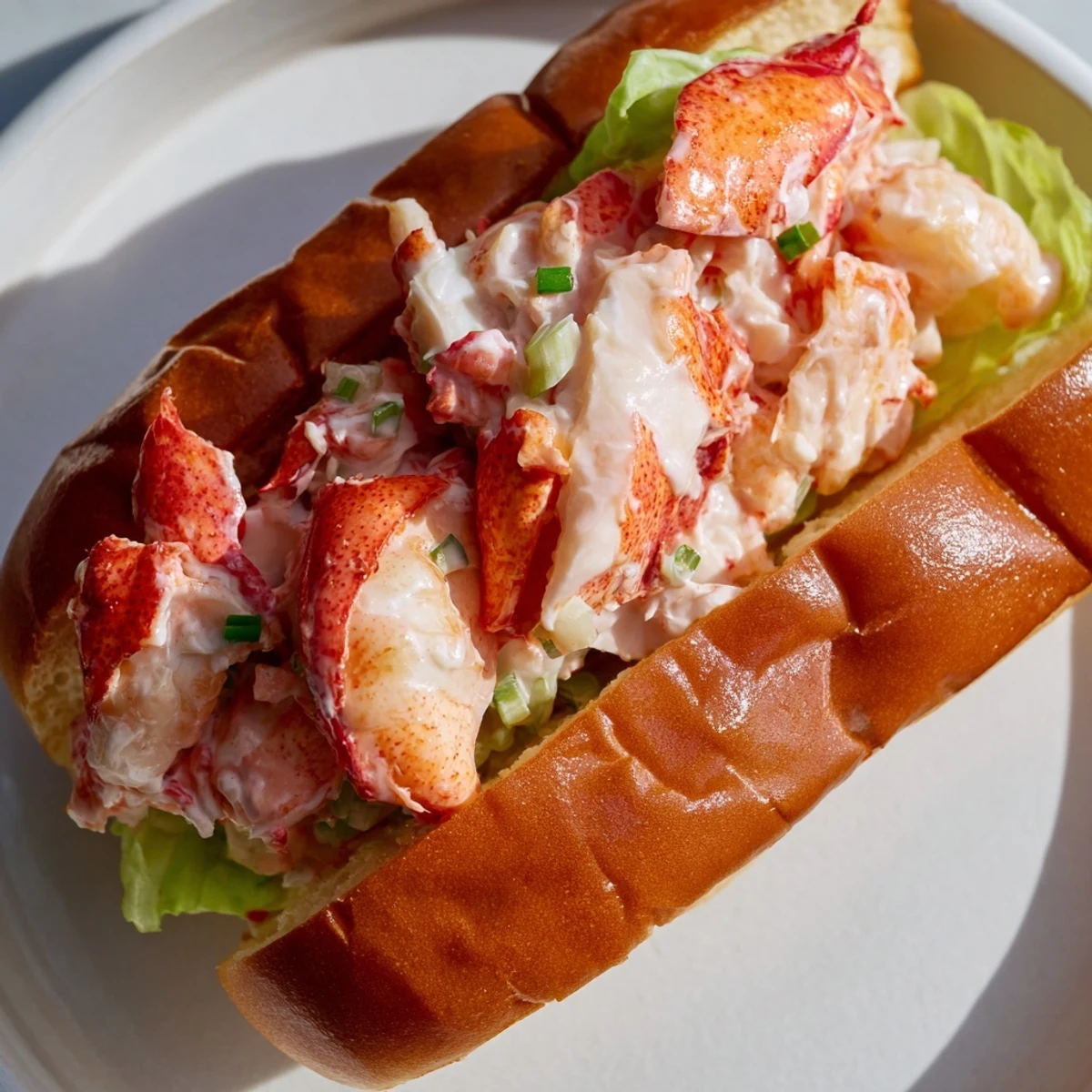 Buttery split-top bun piled high with chilled Maine style lobster roll salad mixture