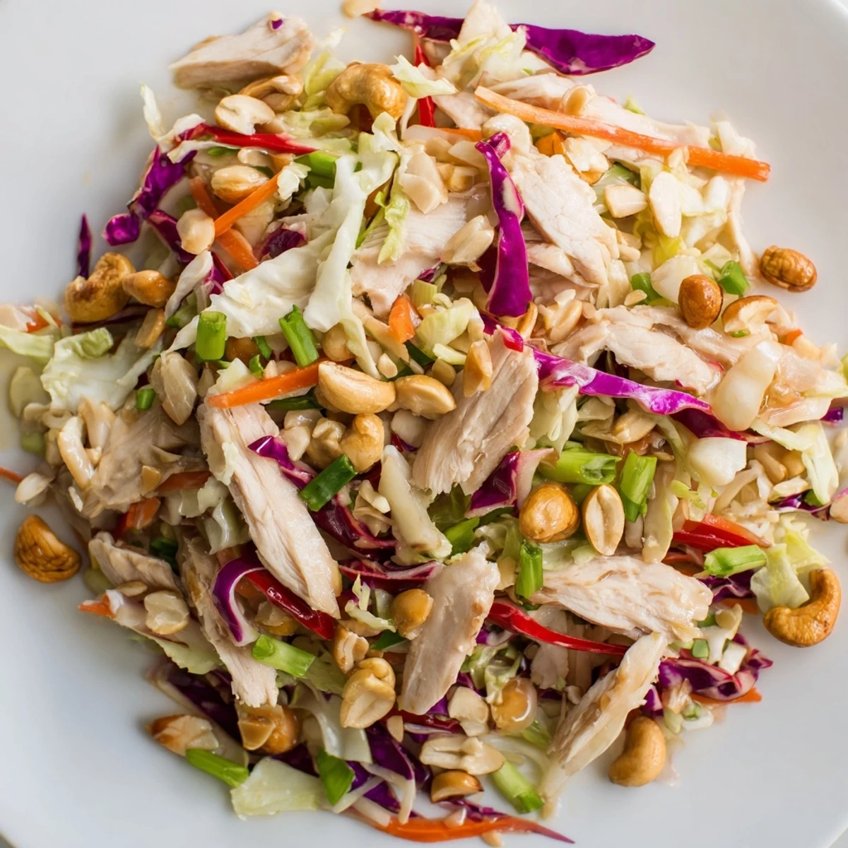 Vibrant Asian chicken cranberry salad featuring shredded chicken, dried cranberries, and crisp vegetables