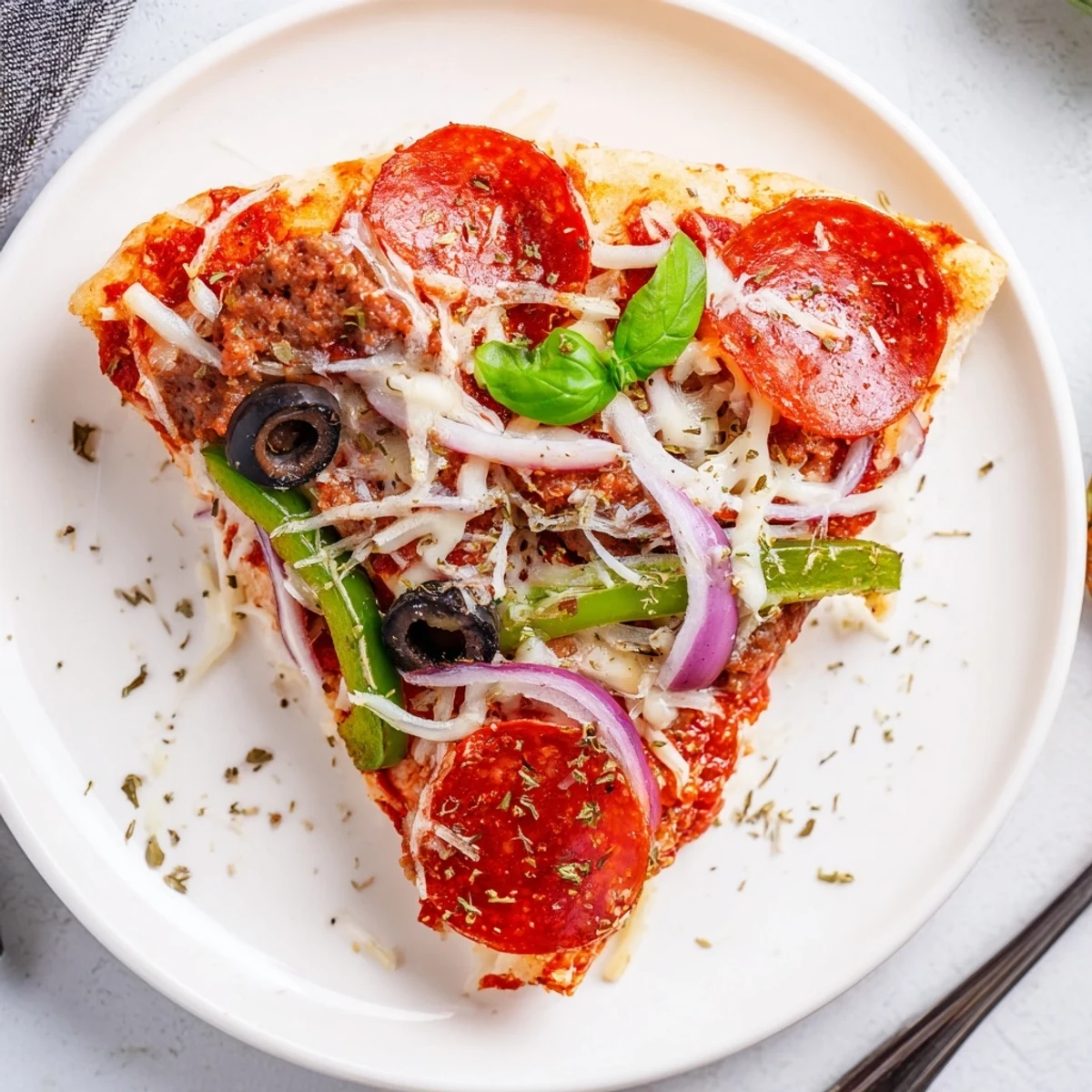 Sliced Focaccia Pizza Supreme resting on a pan, warm, aromatic basil garnish