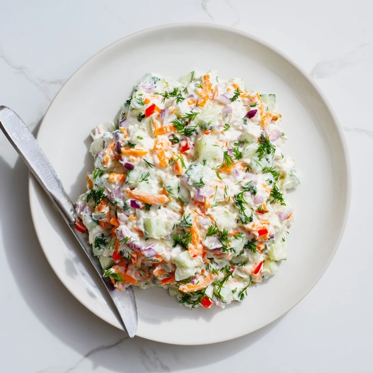 Vegetarian garden vegetable spread with colorful diced vegetables in a white bowl