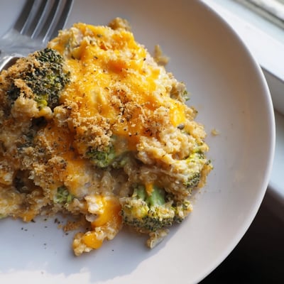 Vegetarian creamy broccoli quinoa casserole topped with crispy breadcrumbs fresh from the oven